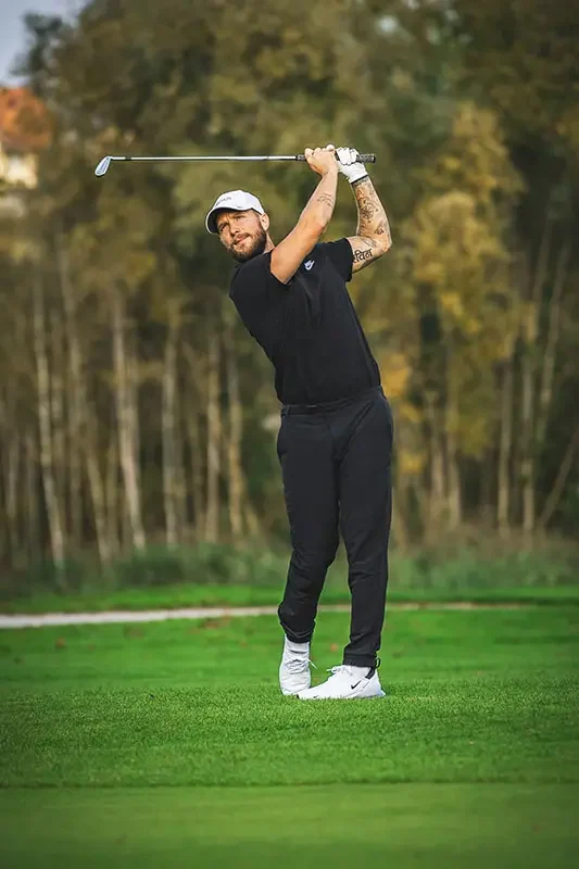 About Us 2 Golfer dressed in black